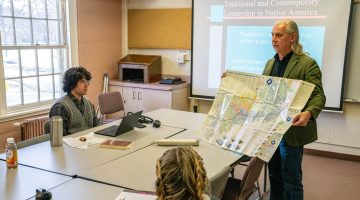 A photo of John Bear Mitchell teaching a class