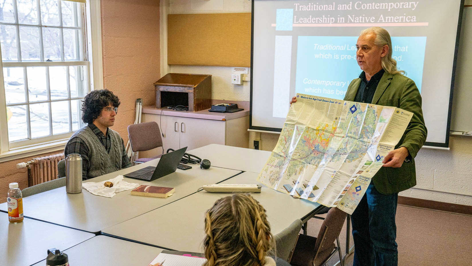 A photo of John Bear Mitchell teaching a class