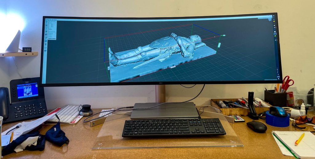 A photo of a computer screen showing the 3D rendering of the knight sculpture