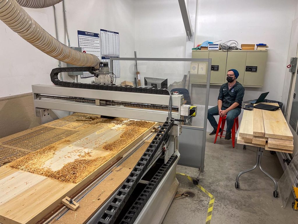 A photo of a machine caving wood