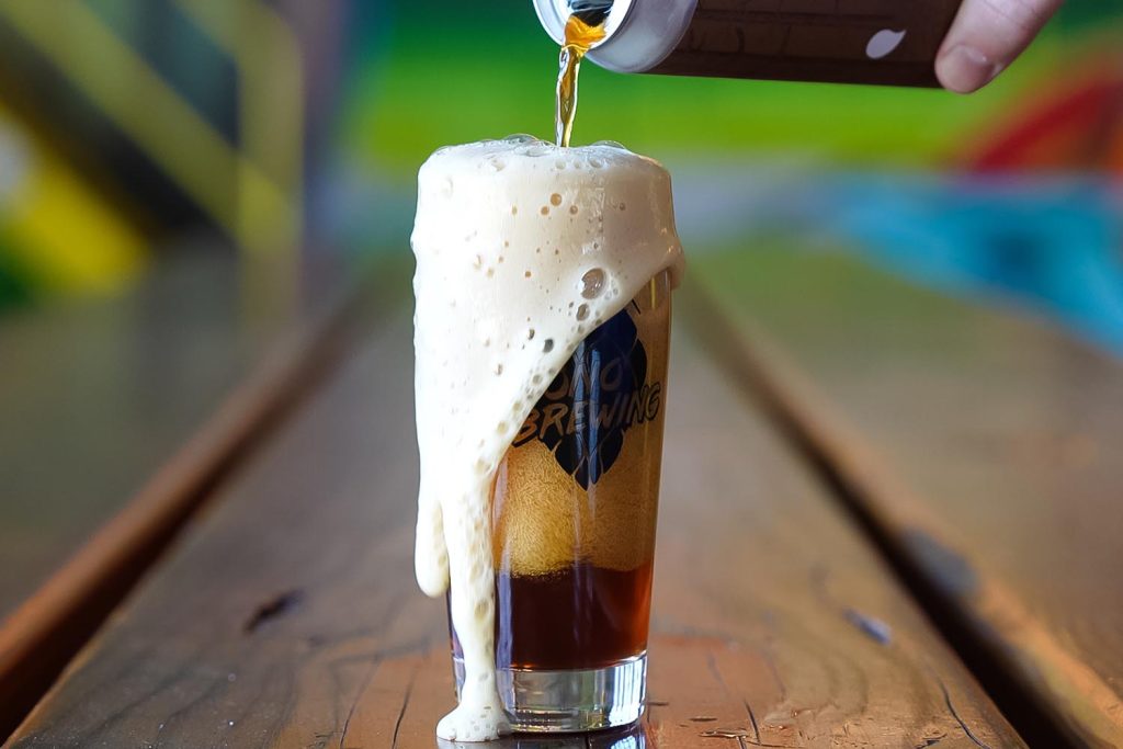 A photo of beer being poured into a glass