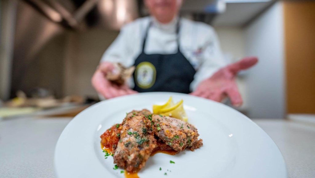 A photo of a plate of meatballs made with squid fins