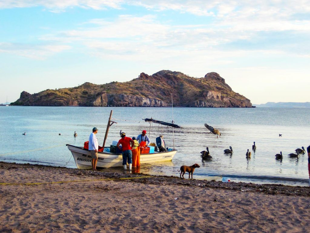 A photo of a fishing boat on a beach