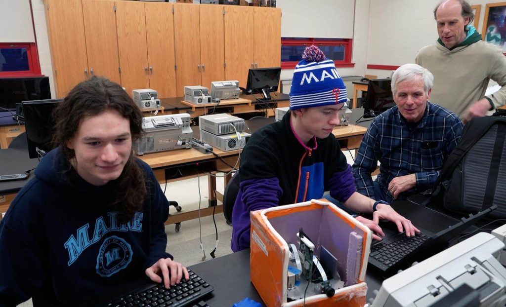 A photo of the researchers working on their balloon payload