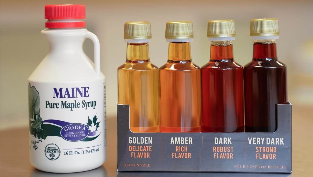 A photo of five different maple syrup bottles