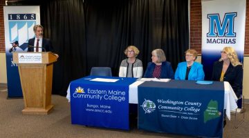 A photo of people sitting at a table