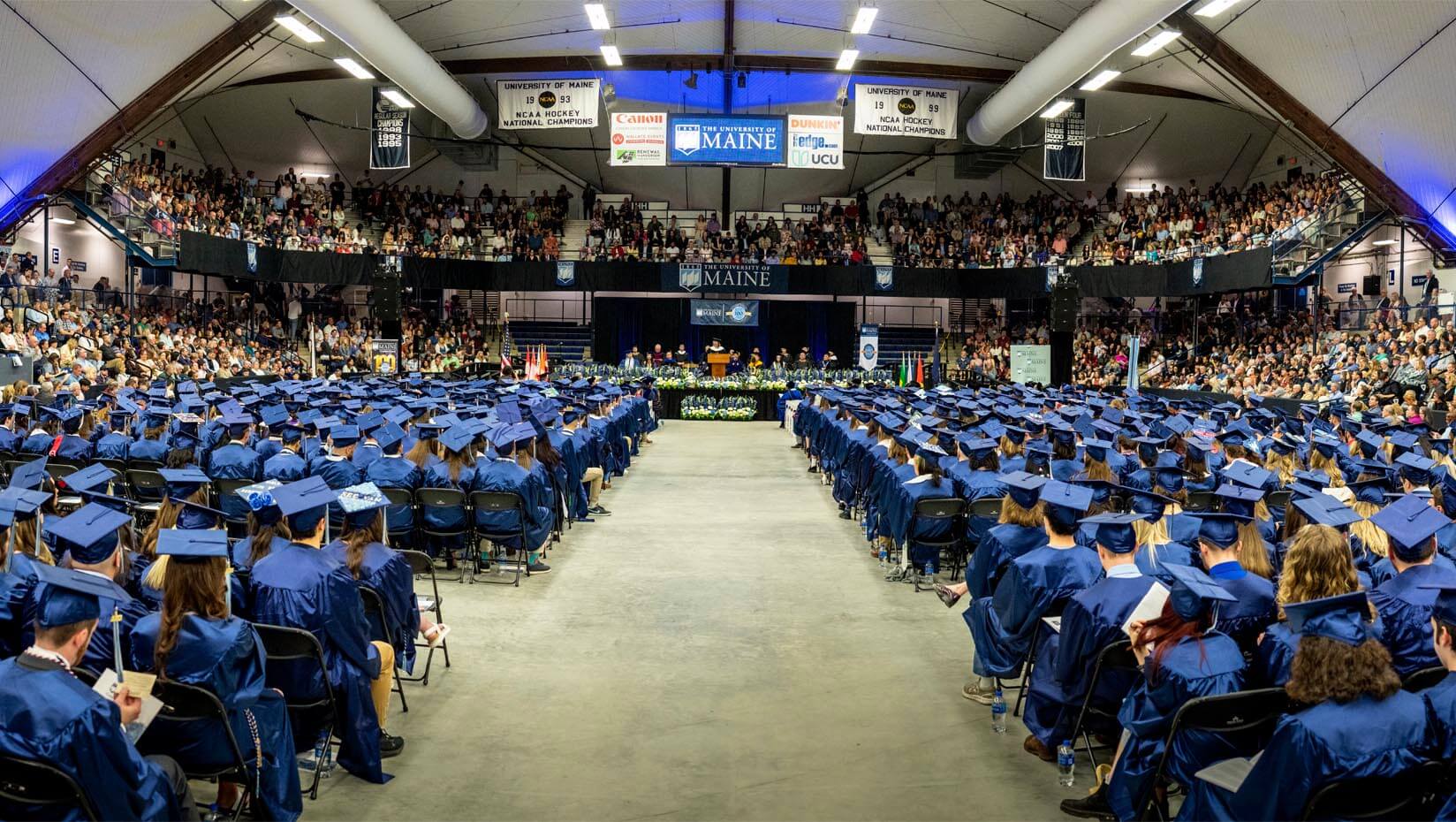 A photo of graduates sitting in seats at commencement