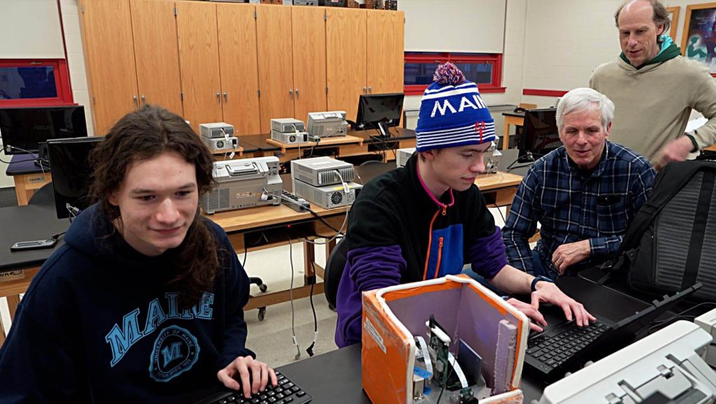 A photo of people working on a high altitude balloon payload