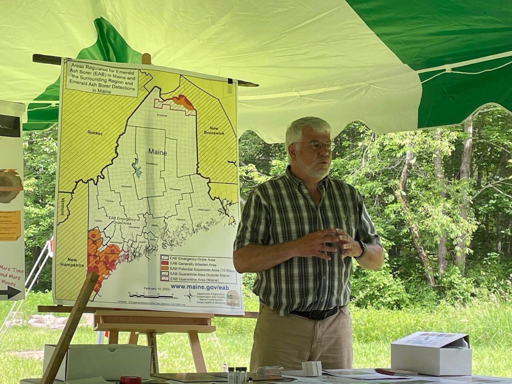A photo of John Daigle at an Audubon presentation