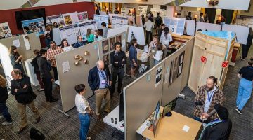 A photo of a Maine Impact Week poster session