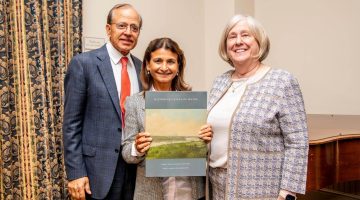 A photo of Raj and Neera Singh and President Joan Ferrini-Mundy