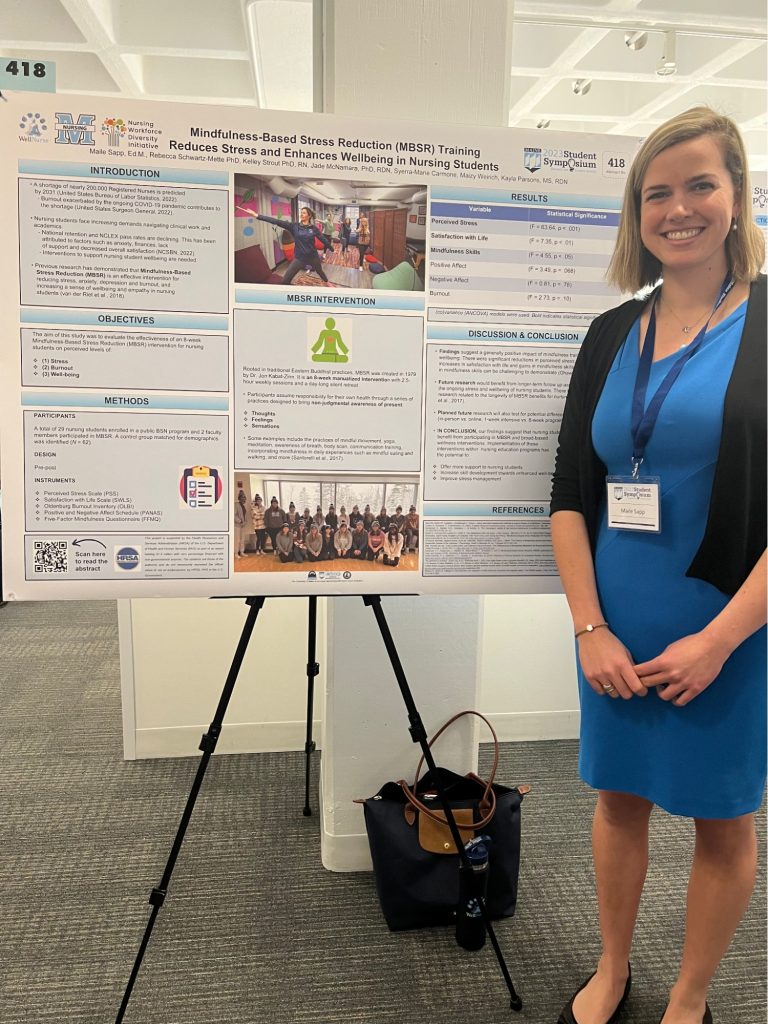 A nursing student showcases her poster on WellNurse