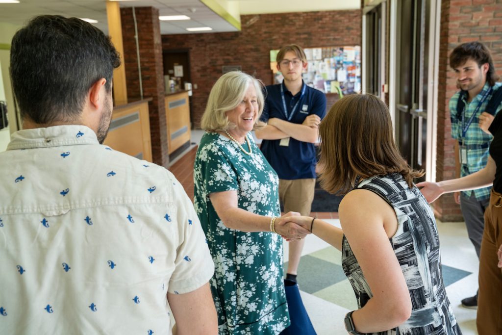 A photo of President Ferrini-Mundy shaking hands