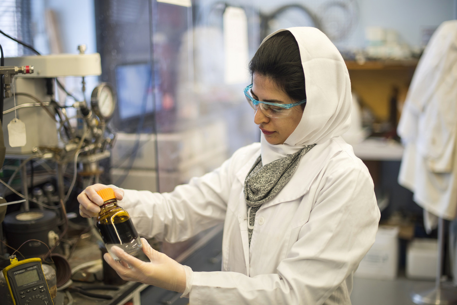 Researcher investigates vial of biofuel