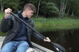 Nolan Altvater working on media documentation on the Penobscot River. Photo Credit: Tyler Quiring