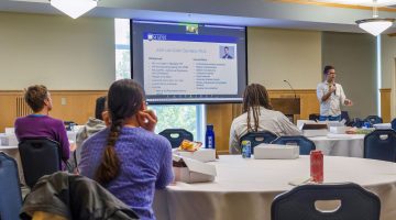 photo of speaker giving presentation
