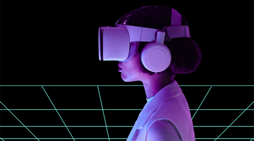 A photo of a person wearing a virual reality headset with a digital grid in the background
