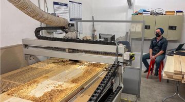 A photo of a machine carving wood at the IMRC Center