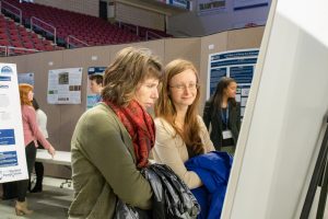 UMSS19 attendees look at poster