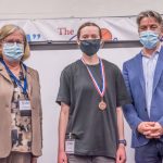 Photo Receiving award Student Symposium 2022 award ceremony