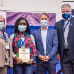 Photo Receiving award Student Symposium 2022 award ceremony