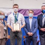 Photo Receiving award Student Symposium 2022 award ceremony