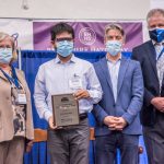 Photo Receiving award Student Symposium 2022 award ceremony