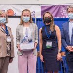 Photo Receiving award Student Symposium 2022 award ceremony