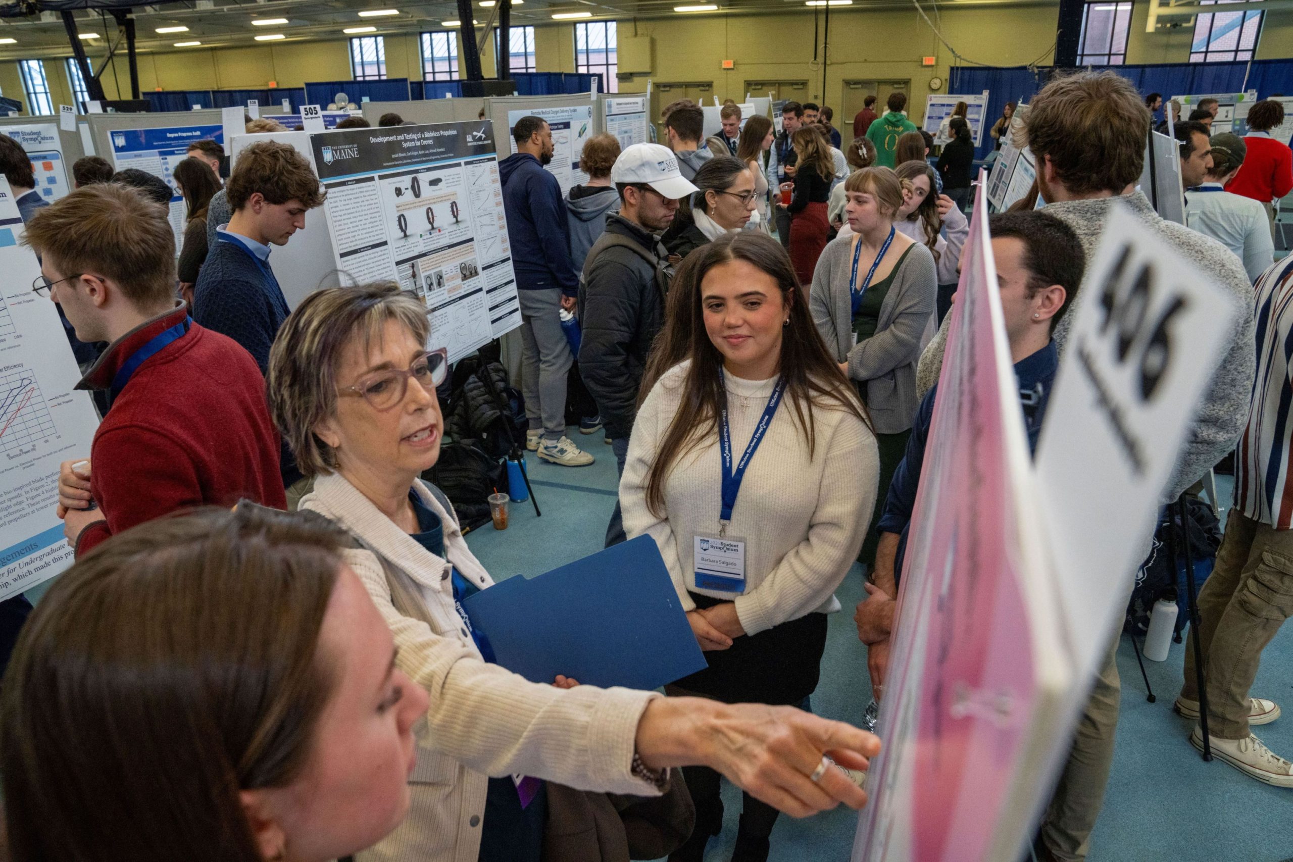 Students view presentations during the 2025 UMaine Student Symposium, held at the New Balance Field House on the UMaine campus on Friday, Apil 11, 2025.