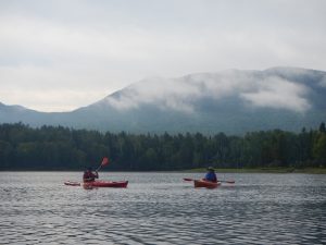 Kayaking on Flagstaff lake with Bigelow mountains in back Stratton-Eustis