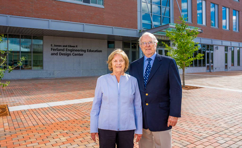 A photo of the Ferlands in front of the Ferland EEDC building